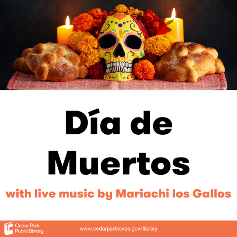 ofrenda with painted skull, bread, and candles